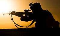 A U.S. Marine with Marine Wing Support Squadron 371 maneuvers through a close quarters combat firing exercise at the Western Barry M. Goldwater Range near Marine Corps Air Station Yuma, Ariz., June 16, 2014.