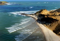 The entrance to The Hokianga HarbourThe Hokianga is an area surrounding the Hokianga Harbour, also known as the Hokianga River, a long estuarine drowned valley on the west coast in the north of the North Island of New Zealand. Original public domain image from Flickr