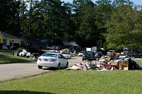 U.S. Airmen and family members from the 169th Fighter Wing, South Carolina Air National Guard, volunteer to provide assistance to residents in a Columbia neighborhood. Original public domain image from Flickr