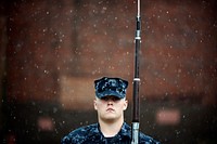 U.S. Navy Seaman Kenyon Crisp, a member of the U.S. Ceremonial Guard Drill Team, performs a left shoulder arms movement during training at Joint Base Anacostia Bolling, District of Columbia, June 21, 2016.