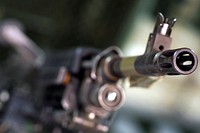 The muzzel of an M240B machine gun is seen as Soldiers assigned to the 98th Support Maintenance Company, 17th Combat Sustainment Support Battalion, U.S. Army Alaska, perform quarterly maintenance on small arms weapons, Tuesday, Sept. 6, 2016, on Joint Base Elmendorf-Richardson, Alaska. This small complement of highly-trained Soldiers maintains and repairs weapons for their battalion as well as the 4th Infantry Brigade Combat Team (Airborne), 25th Infantry Division, U.S. Army Alaska. (U.S. Air Force photo/Justin Connaher). Original public domain image from Flickr