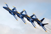 The U.S. Navy Blue Angels perform precision formation flying and aerobatics during the Arctic Thunder Open House at Joint Base Elmendorf-Richardson, Alaska on July 30, 2016. The biennial event is historically the largest multi-day event in the state and one of the premier aerial demonstrations in the world. Arctic Thunder will open its doors to the public, featuring more than 40 key performers and ground acts, July 30 and 31. (U.S. Air Force photo/Alejandro Pena). Original public domain image from Flickr