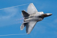 Arctic Thunder Open House 2018A U.S. Air Force F-22 Raptor piloted by a member of the Air Combat Command F-22 Demonstration Team performs aerial maneuvers during the Arctic Thunder Open House at Joint Base Elmendorf-Richardson, Alaska, June 30, 2018. This biennial event hosted by JBER is one of the largest in the state and one of the premier aerial demonstrations in the world. The event features multiple performers and ground acts to include the JBER joint forces, U.S. Air Force F-22 and U.S. Air Force Thunderbirds demonstrations teams, June 30-July 1. (U.S. Air Force photo by Alejandro Peña). Original public domain image from Flickr