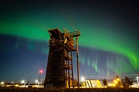 The Aurora Borealis is seen in the night sky over Joint Base Elmendorf-Richardson, Alaska, Friday, Oct. 14, 2016, above a 34-foot-tower once used by U.S. Army Alaska paratroopers to perform pre-jump training for airborne operations. In recent years a new Airborne Sustainment Training Area was built on JBER to serve training needs of the 4th Infantry Brigade Combat Team (Airborne), 25th Infantry Division, USARAK. (U.S. Air Force photo/Justin Connaher). Original public domain image from Flickr