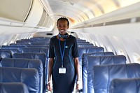 A flight attendant poses for a photograph inside Kenya&#39;s national carrier, Kenya Airways at Adan Adde International Airport in Mogadishu, Somalia on 18 December 2018. Original public domain image from <a href="https://www.flickr.com/photos/au_unistphotostream/31429239967/" target="_blank">Flickr</a>