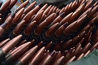 Machine gun ammunition is seen stacked at a supply point as Soldiers assigned to the 95th Chemical Company, &ldquo;Arctic Dragons&rdquo;, 17th Combat Sustainment Support Battalion, U.S. Army Alaska. Original public domain image from Flickr