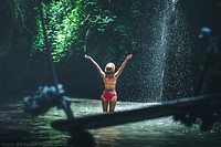 Woman at waterfall, background photo. Free public domain CC0 image.