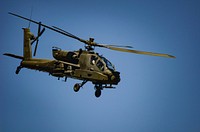 An AH-64 Apache helicopter flies during the South Carolina National Guard Air and Ground Expo at McEntire Joint National Guard Base, South Carolina, May 7, 2017.