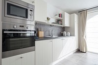 Modern white kitchen. Free public domain CC0 photo.