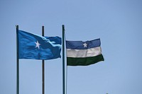 Flags of the Republic of Somalia and Puntland State fly at the State House in Garowe, Somalia, on 17 February 2018.