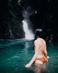 Woman at waterfall. Free public domain CC0 photo.