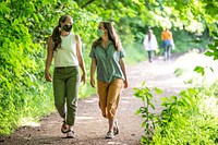 Friends face coverings walking in nature, Oregon. Original public domain image from <a href="https://www.flickr.com/photos/usforestservice/50040421191/" target="_blank">Flickr</a>