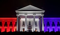 The White House North Portico is lit in red-white and blue lights Saturday evening, July 4, during the Salute to America 2020. Original public domain image from Flickr