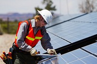 Solar array at Natural BridgesStaff working on the solar panel array at Natural Bridges National Monument. NPS photo by Andrew Kuhn. Original public domain image from Flickr