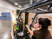 Professional Packaging Systems&#39; Quality Packaging (Qual Pac) Forklift Driver Guadalupe Flores is proud to be a part of the U.S. Department of Agriculture (USDA) Food and Nutrition Service (FNS) Meals to You program that has responded to the school closures due to COVID-19, here one of the partners PepsiCo contracted the logistics company Qual Pac to manage food commodities, bag, assemble, pack, label and ship out utilizing a package delivery company (UPS) to get multiple-week supplemental food boxes to children in rural locations, from their logistics warehouse, in Grand Prairie, TX, on August 13, 2020.