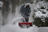 U.S. Airman 1st Class Peter Logar, an air traffic controller with the 366th Operations Support Squadron, removes snow from sidewalks around the Airmen dormitories at Mountain Home Air Force Base, Idaho, Dec. 1, 2010.