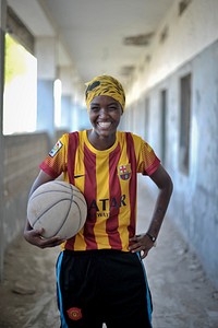 A young Somali girl holds a basketball during a practice session in Mogadishu on June 6. Banned under the extremist group, Al Shabaab, Basketball is once again making a resurgence in Mogadishu. Original public domain image from <a href="https://www.flickr.com/photos/au_unistphotostream/9229502259/" target="_blank">Flickr</a>