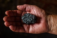 Meteor stone in hand. Free public domain CC0 photo.