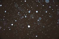 Falling snow on dark sky. Free public domain CC0 image.