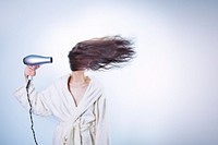 Woman with blow dryer. Free public domain CC0 photo.