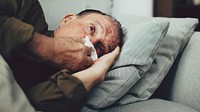 Sick elderly man having coronavirus symptoms