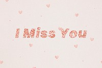 Glittery i miss you typography on heart patterned background