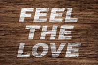 Feel the love printed text typography coarse wood texture