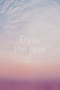 Enjoy the fear quote on a pastel sky background