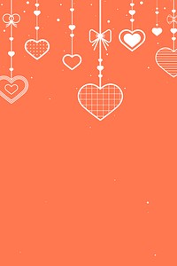 Hanging hearts orange background copy space