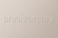 Anniversary embossed text on white paper background