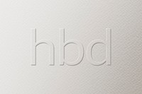 HBD embossed text white paper background