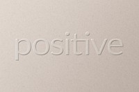 Positive embossed typography white paper background