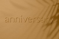 Anniversary word embossed concrete texture shadow plant