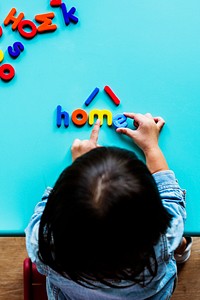 Kid playing with letters background