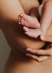 Mother holding her baby photo