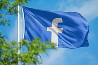 Facebook icon for social media on flag. 26 MAY 2022 - BANGKOK, THAILAND