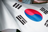 Person holding South Korean flag background, national symbol