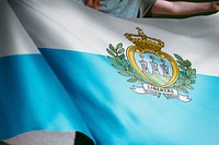 Person holding San Marino flag background, national symbol