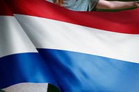 Person holding Netherlands flag background, national symbol