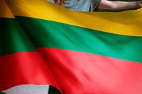 Person holding Lithuania flag background, national symbol