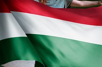 Person holding Hungarian flag background, national symbol