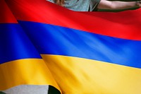 Person holding Armenia flag background, national symbol