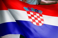 Person holding Croatia flag background, national symbol