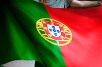 Person holding Portuguese flag background, national symbol