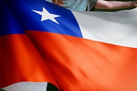 Person holding Chile flag background, national symbol