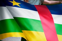 Person holding Central African Republic flag, national symbol