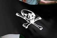 Person holding black Pirate skull flag background