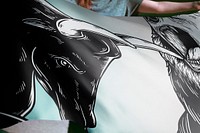 Person holding bull and bear fighting flag