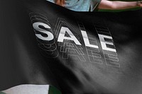 Person holding black sale flag, Font effect background