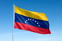 Waving Venezuela flag, national symbol, blue sky
